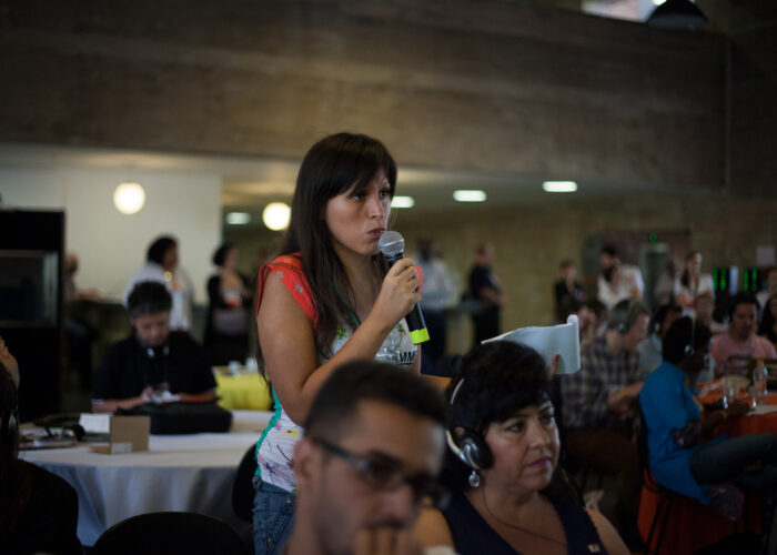 Audience member asking a question at the 14th Conectas Human Rights Colloquium