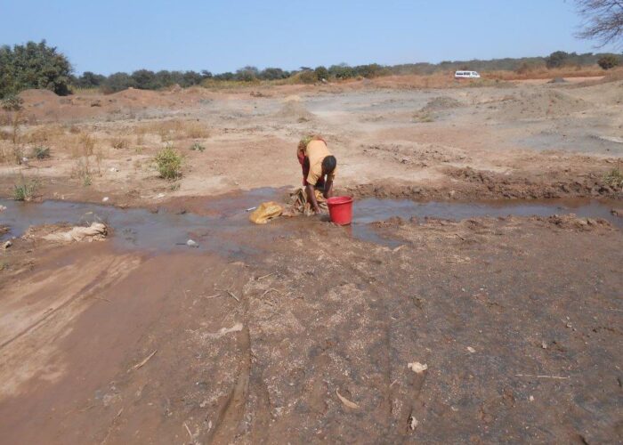 Woman working at an artisanal mine in DRC