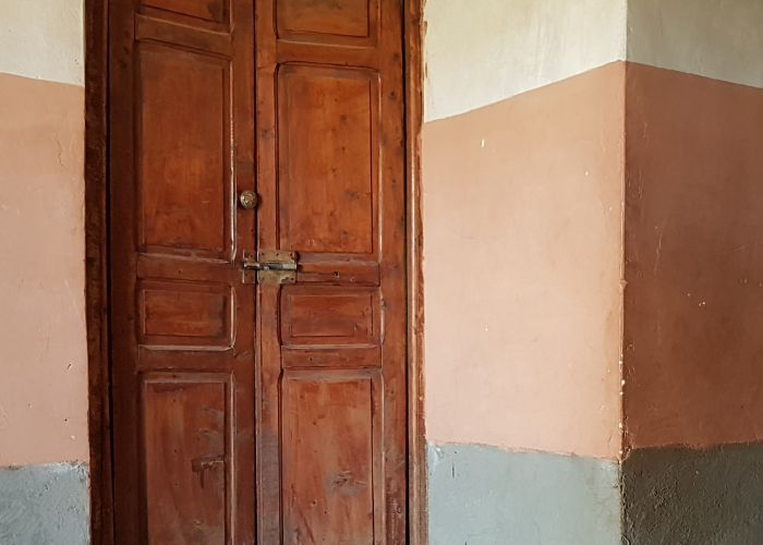 A middle eastern woman holding her child