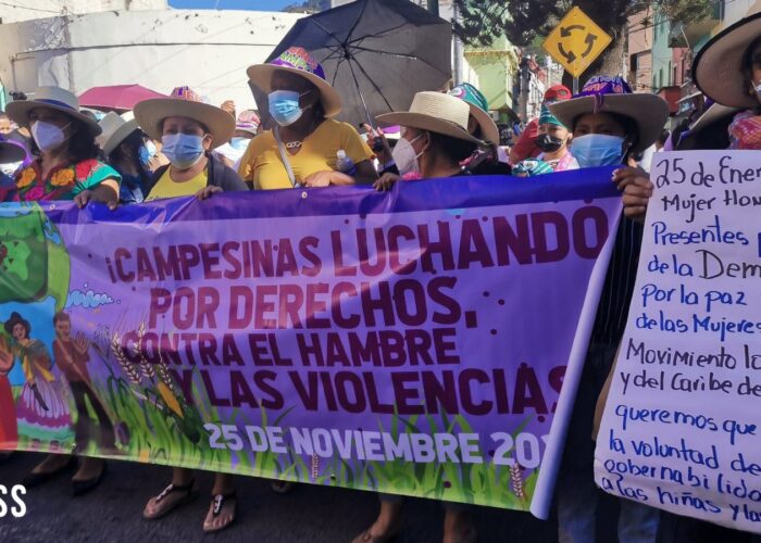 JASS and allies carrying banners in Honduras in celebration of Honduran Women's Day