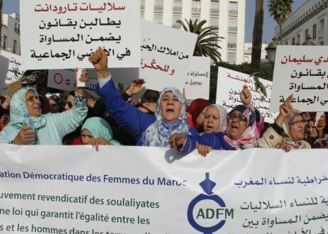 ADFM protesters holing signs and banners in arabic