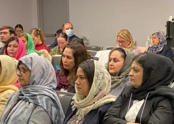 Photos of women in the audience at the Afghan-Canadian Women's Symposium