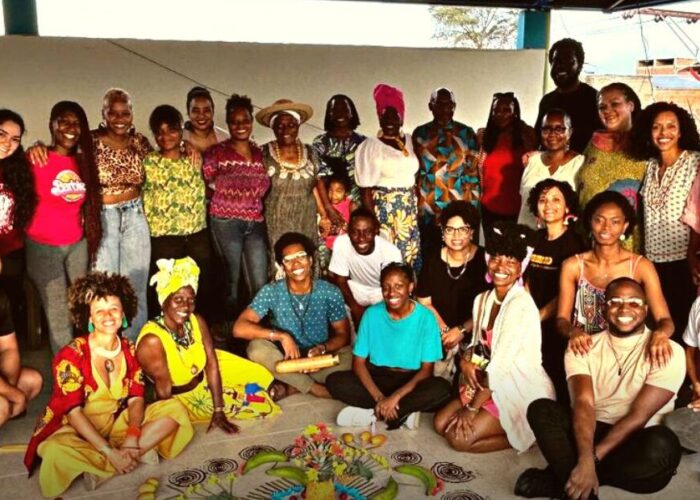 large group of people standing or sitting posing for photo