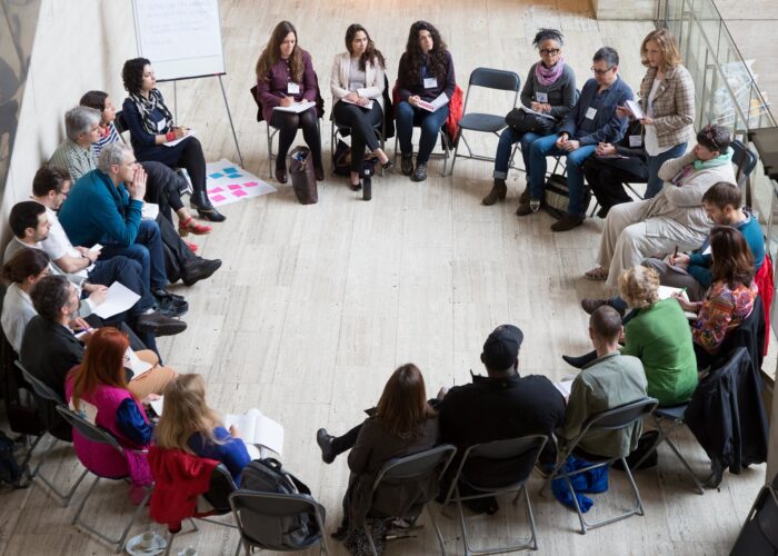 EDGE participants sitting in a chair circle discussion
