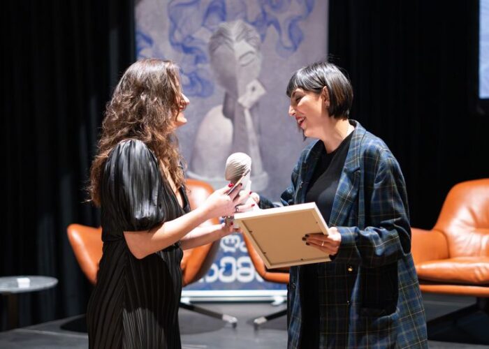 Woman receiving an award at a Women's Fund in Georgia event