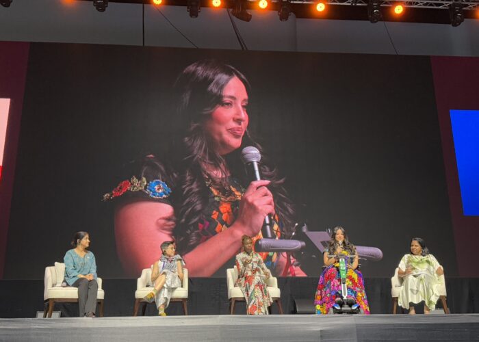 Participants on stage at An AWID event
