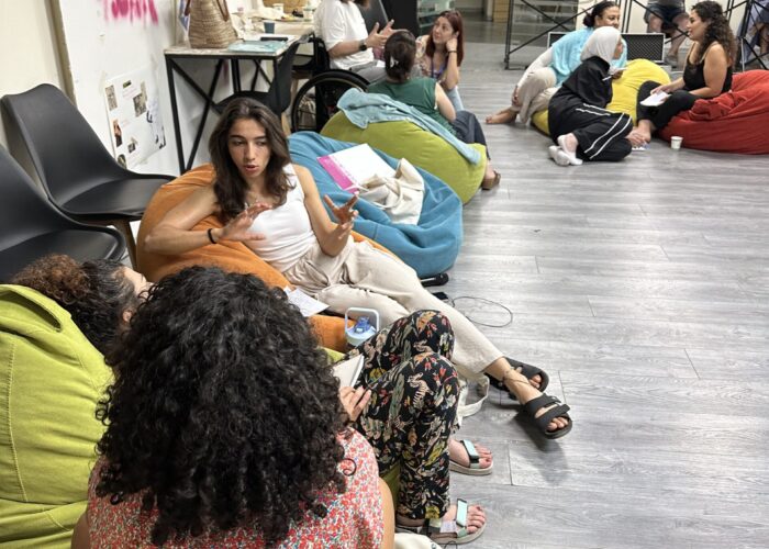 Femena participants engaged in individual breakout conversations at the Yara WHRD Center