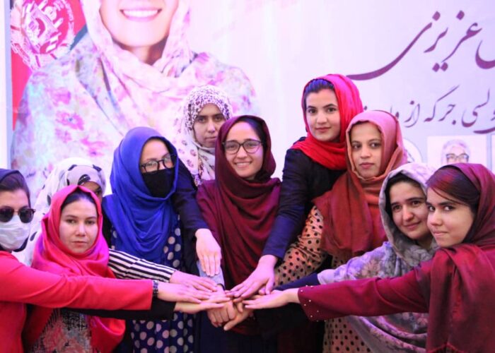 Mina's List aspiring candidates putting their hand together at a campaign event