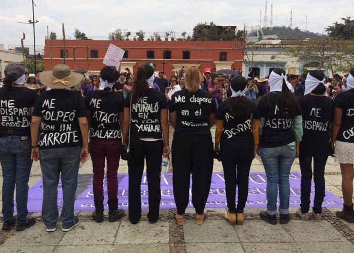Protesters with handmade t-shirts with messages protesting femicide in Oaxaca