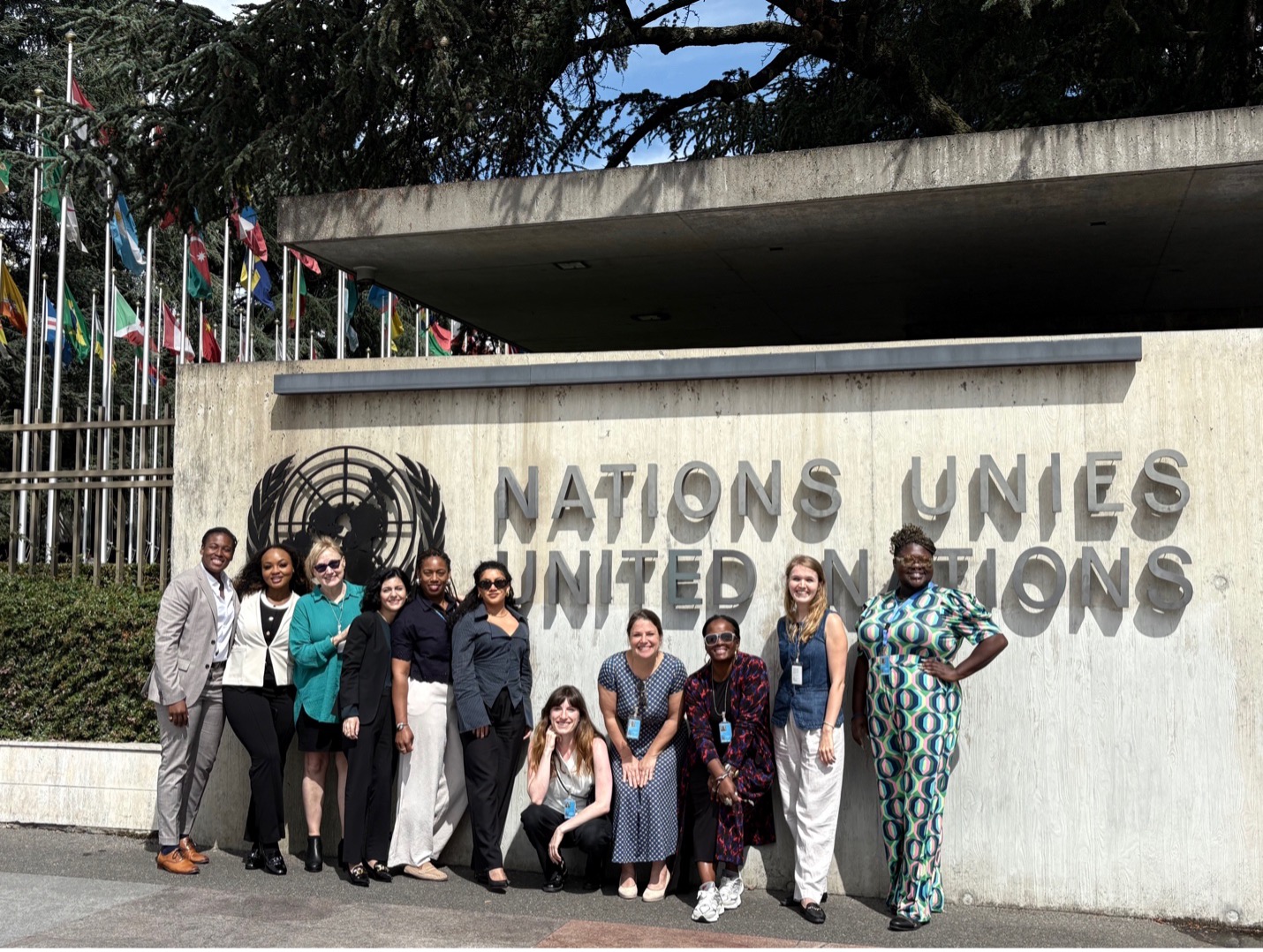 Women stand in front of United Nations Sign