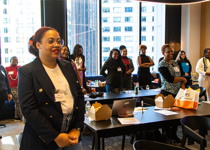 Haitian women leaders stand in conference room